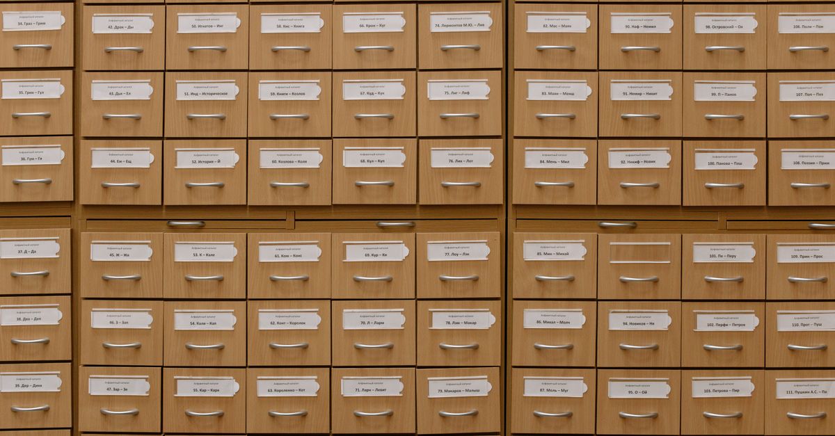 Close-up of labeled wooden storage drawers, perfect for organization concepts.